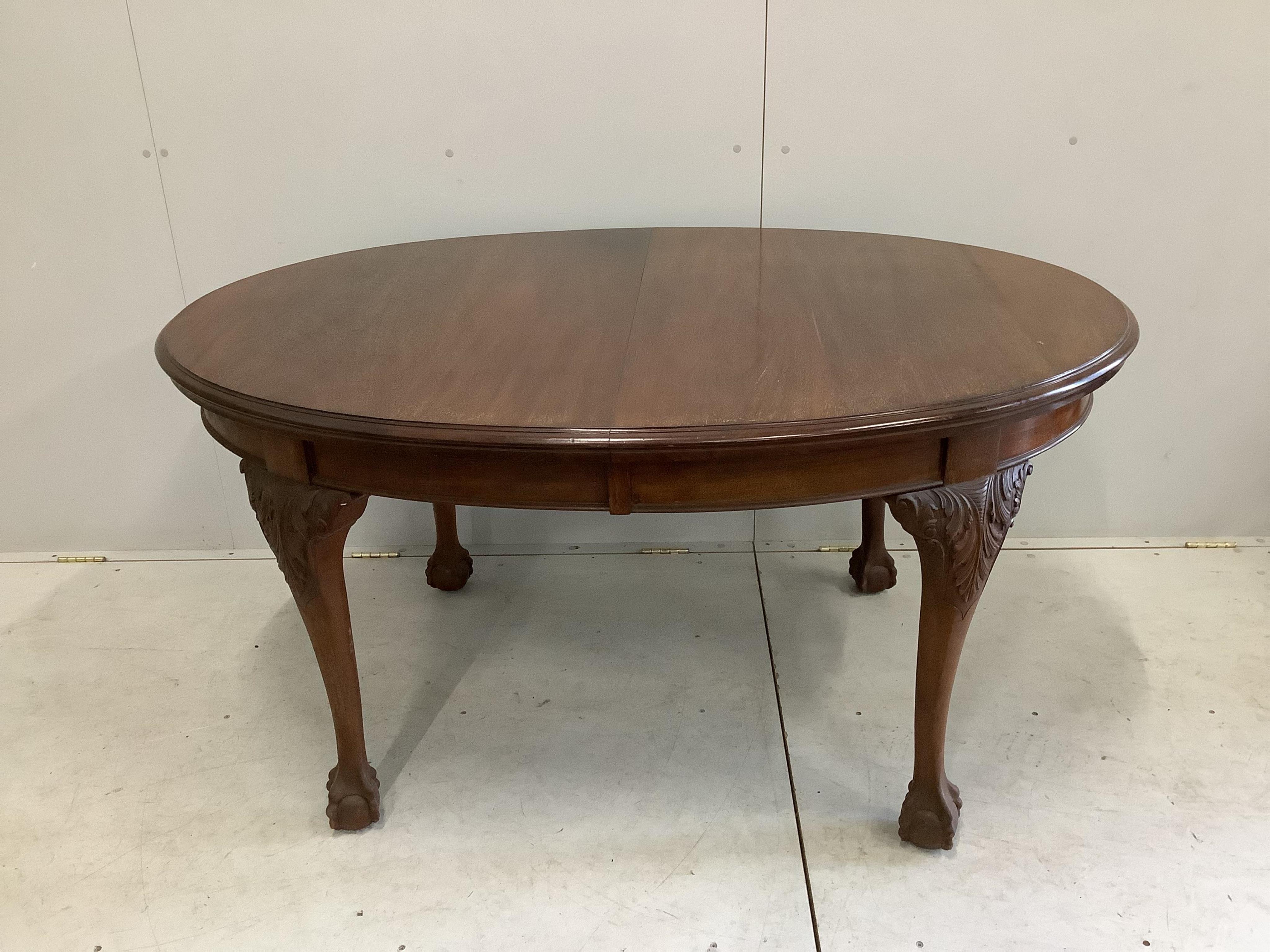 A Chippendale Revival mahogany dining suite comprising extending dining table, 210cm extended, two spare leaves, depth 106cm, height 75cm, bowfront sideboard and serving table, together with six dining chairs (two with a